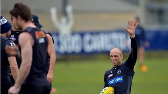 Hands up who wants a flag: Chris Judd in training.