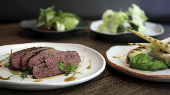 Roast veal rump and a selection of sides.