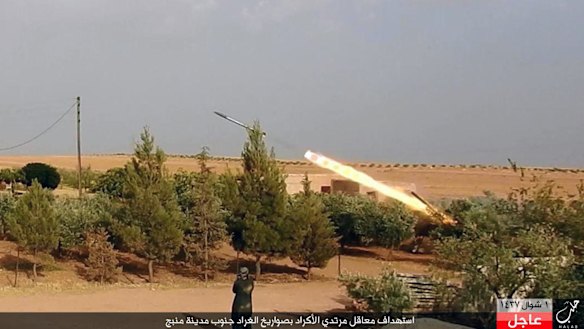 A member of Islamic State militants fires a Grad missile towards Kurdish-led forces in Manbij.
