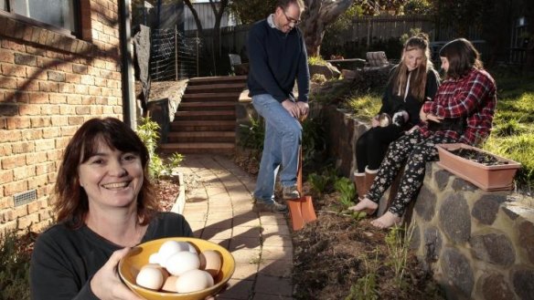 Jane Dickenson, Dave Anderson, Kerri Anderson and Ruby O'Hart in their compact garden.