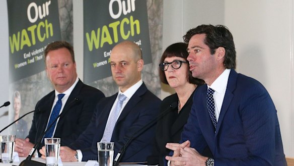 AFL chief executive Gillon McLachlan (far right) at an 'Our Watch' event.