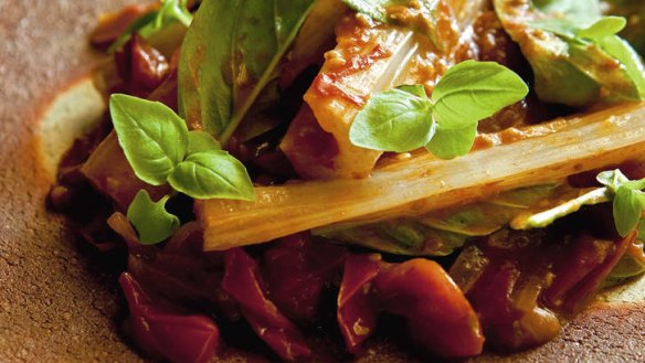 Braised silverbeet stalks in cherry tomato sauce.