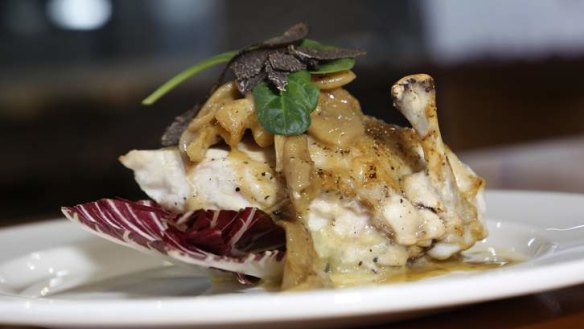 Presentation ... Chicken breast filled with truffle brie with a truffle butter and mushroom sauce.