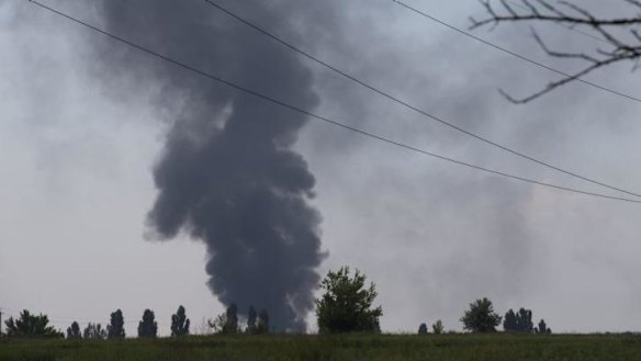 Black smoke rises from the downed Ukrainian Army helicopter outside Slovyansk on Thursday.