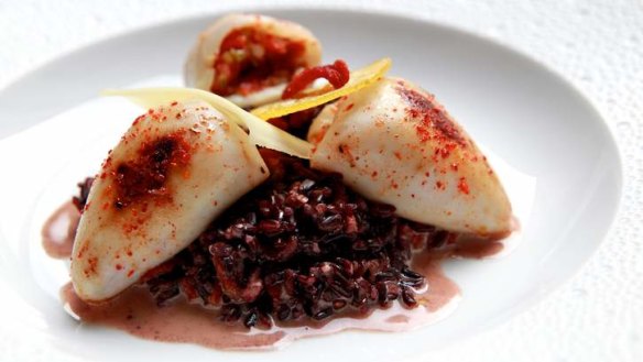 Slow cooking can tenderise squid. Pictured is a baby squid risotto from Ananas Bar and Brasserie in Sydney.