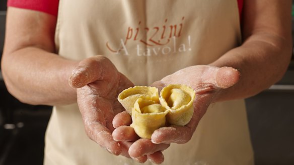 Katrina Pizzini displays some Italian delicacies.
