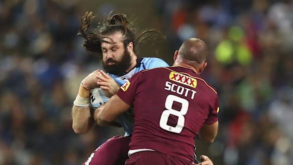 Up front: Aaron Woods collides with Matt Scott.