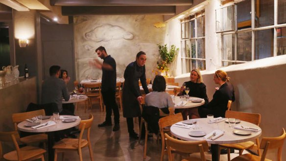 The basement restaurant's soft grey interior.