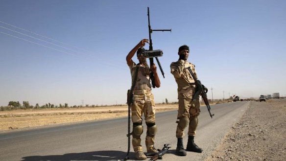 Fighters from the Shi'ite Badr Brigade militia set up a mobile checkpoint in Suleiman Beg, northern Iraq.