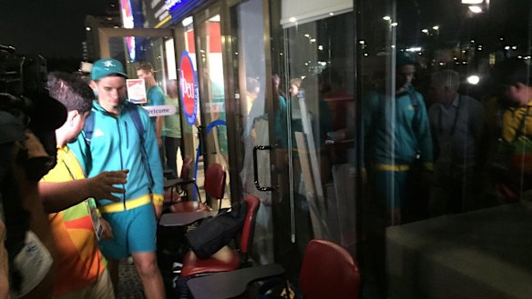 Archer Alec Potts walks to the judge's chambers after hours of questioning by police. 