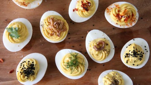 Devilled eggs are making a comeback: Spruce them up with your choice of toppings such as crisp-fried shallots, anchovy fillets or crushed pappadums.