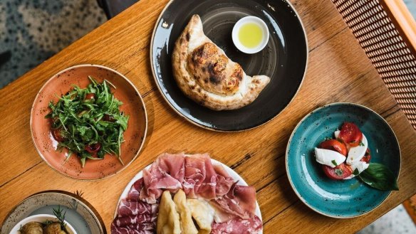 A spread at Beer, Wine and Calzone.