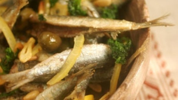 Fried whole sardines with olives, pine nuts and parsley