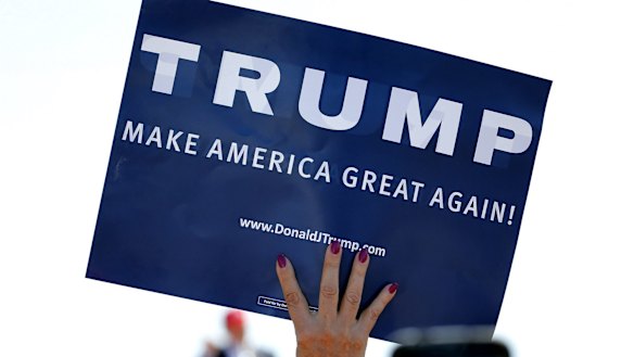 A supporter holds a sign backing Donald Trump at a rally in Arizona.