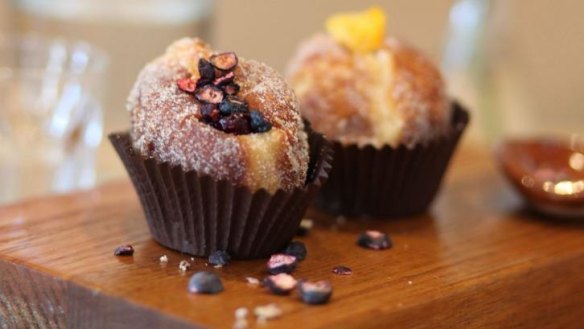 Matt Forbes' orange blossom and blueberry (left) and mandarin marmalade and chocolate custard doughnuts at Cobb Lane.