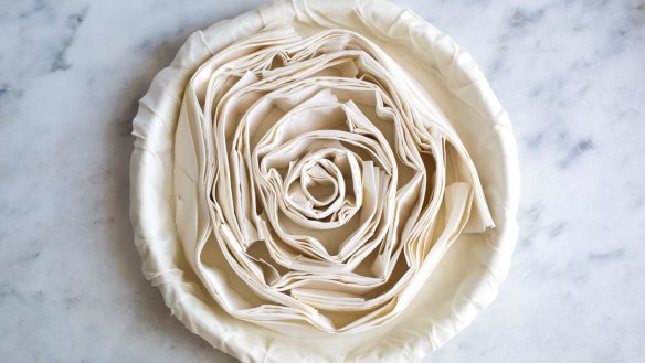 Swirled layers of filo dough in place and ready to receive the filling.