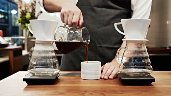 'It's not a secret science': A barista prepares pourover coffee.