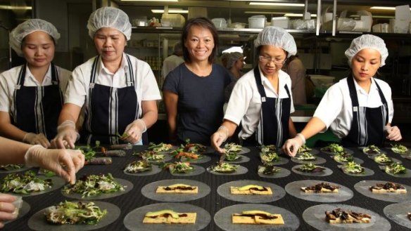 Nahji Chu, centre, with staff in Sydney.