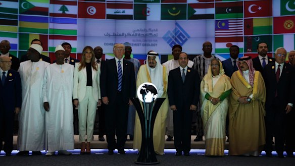 President Donald Trump and Saudi King Salman pose for photos near the orb.