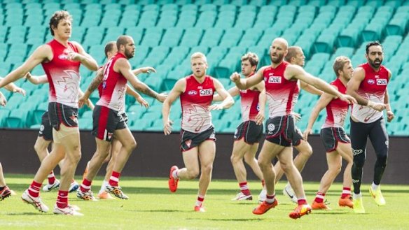 Twisting times: Swans players train at the SCG on Monday.