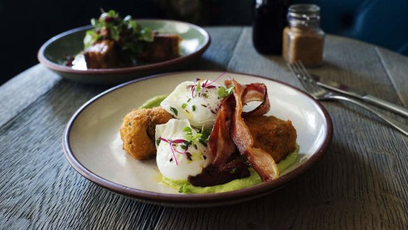 Bacon croquettes with poached eggs, bacon and avocado puree.