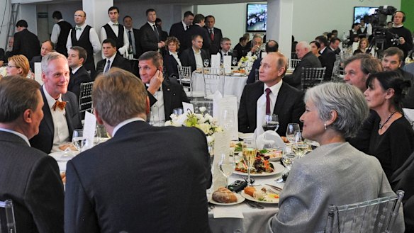 Michael Flynn (centre left) next to President Vladimir Putin at an event celebrating RT in Moscow. Jill Stein, 2016 US Greens candidate, is seen with her back to camera. 