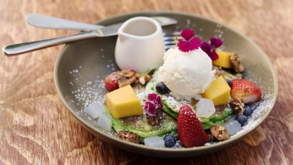 Pandan buttermilk pancakes served with coconut ice-cream and fresh mango and berries.
