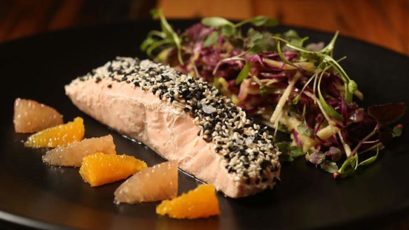 Sesame crust salmon with asian slaw, ruby grapefruit and ponzu.