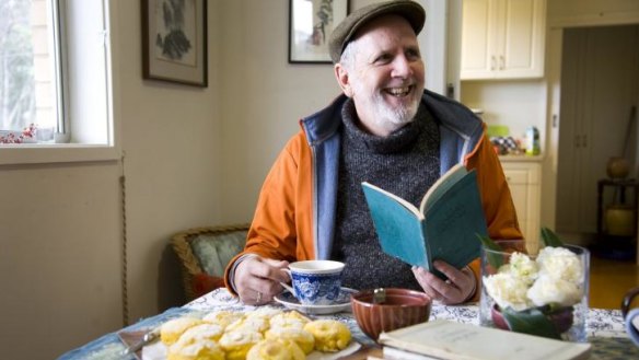 Greg Johnson with his early editions of <i>The Canberra Gardener</i> and home-made pumpkin scones.