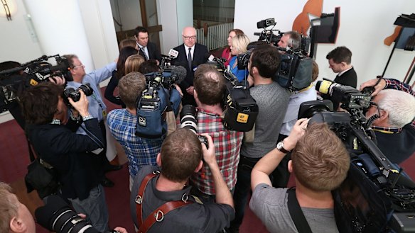 Attorney-General Senator George Brandis addresses the media in the press gallery on Thursday.