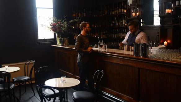 Higher ground: James Tait holds court behind the bar at Thomas Olive.