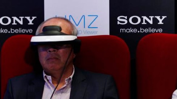 Reporters try Sony's head mounted display.