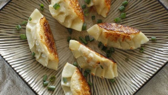 Pork mince gyoza are delicious dipped into a soy and vinegar dressing.