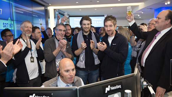 Atlassian founders Scott Farquhar and Mike Cannon-Brookes watch as shares in their company begin trading in New York.