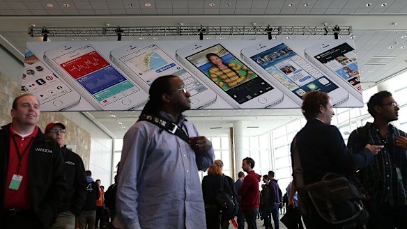 Attendees gather at the Apple Worldwide Developers Conference, where the company unveiled iOS 8 and the new mac operating system Yosemite.