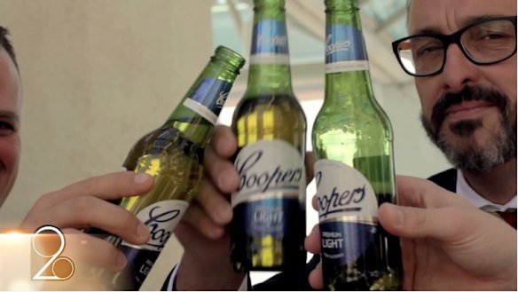 The video is laced with lingering shots of Coopers beers.
