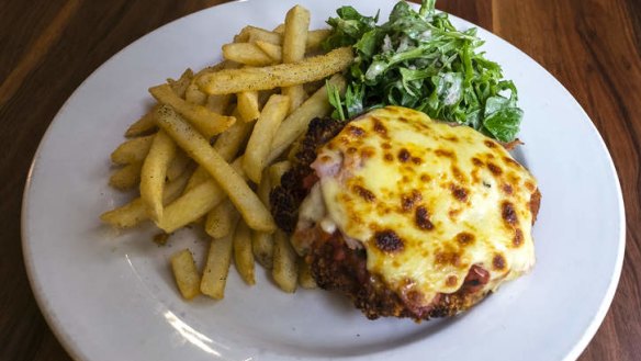 Pub grub: Chicken parma, chips and salad.