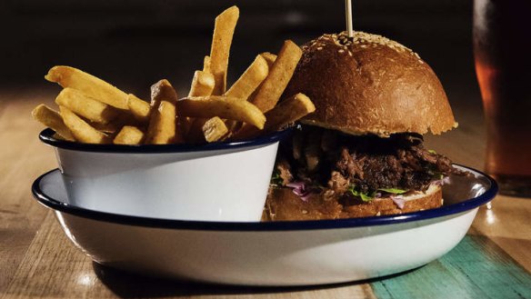 Pulled lamb burger with fries.