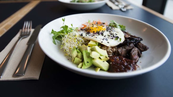 Breakfast, Muse-style: Brown rice with crisp beef tapa, sprouts, fried egg and chilli jam.