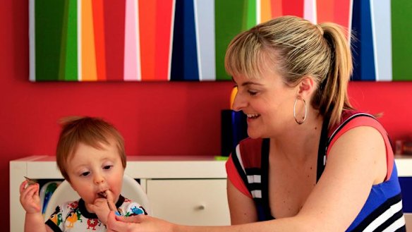Finger-lickin' good ... Nicole Bridges allows her son, Quinn, to decide how soon he'll switch to solids.