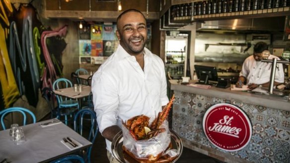 St James' owner Gideon James with a bag of Singapore chilli crab.