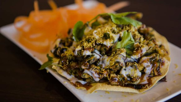 Palak papdi chaat - spinach fritter topped with chickpeas and yoghurt.