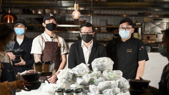 Restaurateur Jason Chang (centre) and his staff at Calia at Melbourne Emporium in the CBD, which is dealing with customer abuse and uncollected food due to a lack of Uber Eats drivers.