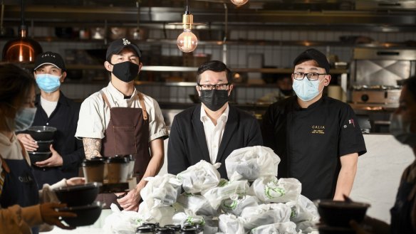 Restaurateur Jason Chang (centre) and his staff at Calia at Melbourne Emporium in the CBD, which is dealing with customer abuse and uncollected food due to a lack of Uber Eats drivers.