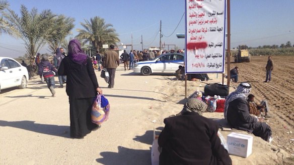 Displaced civilians leave Ramadi on Monday. 