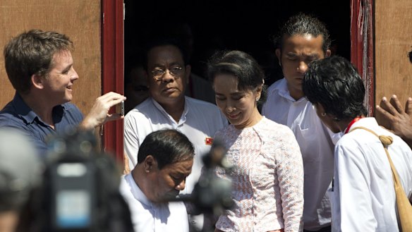 Leader of Myanmar's National League for Democracy party, Aung San Suu Kyi leaves NLD headquarters after delivering a speech to her supporters in Yangon on Monday. 