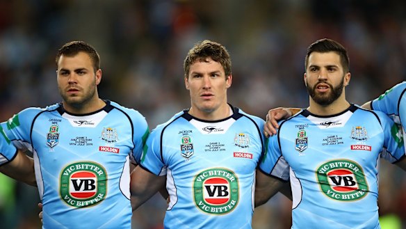 Career milestone: James Tedesco lines up pre-game during the national anthem with fellow debutant Wade Graham and back-rower Josh Jackson.