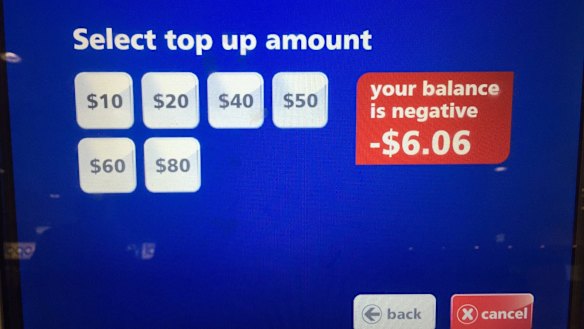 The Herald's Opal card screen shows a negative balance. The card was topped up, not discarded, following the experiment.