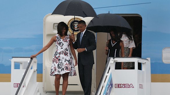 US President Barack Obama, Michelle Obama and Sasha Obama (right) arrive at Jose Marti International Airport on Air Force One for a 48-hour visit to Cuba.