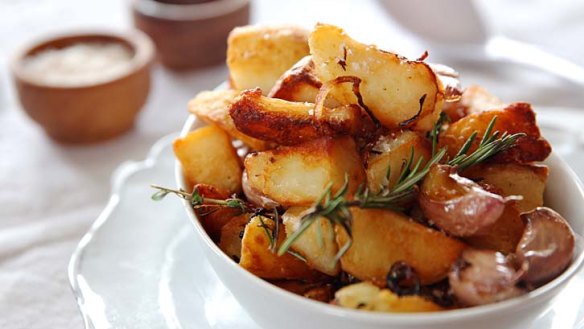 Golden and crunchy: Duck-fat potatoes with garlic and rosemary.